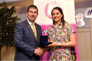 14 May 2022; Aoibhinn Gilmartin of Old Leighlin GAA club in Carlow is presented with her graduation medallion by Uachtarán Cumann Peil Gael na mBan, Mícheál Naughton, during the Learn to Lead LGFA Female Leadership Programme graduation evening at the Bonnington Hotel in Dublin. The Learn to Lead programme was devised to develop the next generation of leaders within Ladies Gaelic Football. Photo by Brendan Moran/Sportsfile