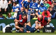14 May 2022; James Lowe of Leinster receives treatment from Leinster head physiotherapist Garreth Farrell during the Heineken Champions Cup Semi-Final match between Leinster and Toulouse at the Aviva Stadium in Dublin. Photo by Harry Murphy/Sportsfile