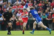 15 May 2022; Niall Toner of Derry shoots under pressure from Darren Hughes of Monaghan during the Ulster GAA Football Senior Championship Semi-Final match between Derry and Monaghan at Athletic Grounds in Armagh. Photo by Ramsey Cardy/Sportsfile
