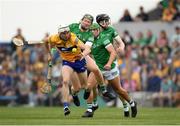 15 May 2022; Ryan Taylor of Clare is tackled by William O'Donogue of Limerick during the Munster GAA Hurling Senior Championship Round 4 match between Clare and Limerick at Cusack Park in Ennis, Clare. Photo by Ray McManus/Sportsfile