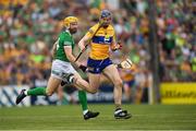 15 May 2022; David Fitzgerald of Clare is tackled by Séamus Flanagan of Limerick during the Munster GAA Hurling Senior Championship Round 4 match between Clare and Limerick at Cusack Park in Ennis, Clare. Photo by Ray McManus/Sportsfile