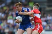 15 May 2022; Kieran Duffy of Monaghan is tackled by Shane McGuigan of Derry during the Ulster GAA Football Senior Championship Semi-Final match between Derry and Monaghan at Athletic Grounds in Armagh. Photo by Ramsey Cardy/Sportsfile