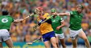 15 May 2022; John Conlon of Clare is tackled by William O'Donogue and Declan Hannon, 6, of Limerick during the Munster GAA Hurling Senior Championship Round 4 match between Clare and Limerick at Cusack Park in Ennis, Clare. Photo by Ray McManus/Sportsfile