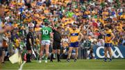 15 May 2022; Referee Colm Lyons shows a yellow catrd to Gearóid Hegarty of Limerick, 10, during the Munster GAA Hurling Senior Championship Round 4 match between Clare and Limerick at Cusack Park in Ennis, Clare. Photo by Ray McManus/Sportsfile