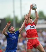 15 May 2022; Conor Doherty of Derry and Andrew Woods of Monaghan during the Ulster GAA Football Senior Championship Semi-Final match between Derry and Monaghan at Athletic Grounds in Armagh. Photo by Ramsey Cardy/Sportsfile