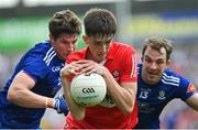 15 May 2022; Paul Cassidy of Derry evades the tackle of Darren Hughes, left, and Jack McCarron of Monaghan during the Ulster GAA Football Senior Championship Semi-Final match between Derry and Monaghan at Athletic Grounds in Armagh. Photo by Ramsey Cardy/Sportsfile