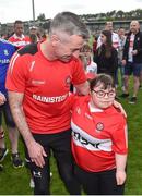 15 May 2022; Derry manager Rory Gallagher celebrates with supporter Sorcha Moran, from Desertmartin, Co Derry, after the Ulster GAA Football Senior Championship Semi-Final match between Derry and Monaghan at Athletic Grounds in Armagh. Photo by Daire Brennan/Sportsfile