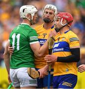 15 May 2022; Kyle Hayes of Limerick with Conor Cleary and John Conlon of Clare after the Munster GAA Hurling Senior Championship Round 4 match between Clare and Limerick at Cusack Park in Ennis, Clare. Photo by Ray McManus/Sportsfile