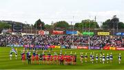 15 May 2022; The Monaghan and Derry teams stand with their team-mates for the national anthem ahead of the Ulster GAA Football Senior Championship Semi-Final match between Derry and Monaghan at Athletic Grounds in Armagh. Photo by Daire Brennan/Sportsfile