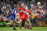 15 May 2022; Ethan Doherty of Derry in action against Mícheál Bannigan of Monaghan during the Ulster GAA Football Senior Championship Semi-Final match between Derry and Monaghan at Athletic Grounds in Armagh. Photo by Daire Brennan/Sportsfile