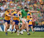 15 May 2022; Gearóid Hegarty of Limerick is tackled by David Reidy and David McInerney of Clare during the Munster GAA Hurling Senior Championship Round 4 match between Clare and Limerick at Cusack Park in Ennis, Clare. Photo by Ray McManus/Sportsfile