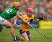 15 May 2022; John Conlon of Clare is tackled by Tom Morrisey of Limerick during the Munster GAA Hurling Senior Championship Round 4 match between Clare and Limerick at Cusack Park in Ennis, Clare. Photo by Ray McManus/Sportsfile