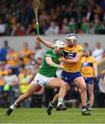 15 May 2022; Kyle Hayes of Limerick is tackled by Diarmuid Ryan of Clare during the Munster GAA Hurling Senior Championship Round 4 match between Clare and Limerick at Cusack Park in Ennis, Clare. Photo by Ray McManus/Sportsfile