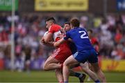 15 May 2022; Shane McGuigan of Derry in action against David Garland, left, and Kieran Duffy of Monaghan during the Ulster GAA Football Senior Championship Semi-Final match between Derry and Monaghan at Athletic Grounds in Armagh. Photo by Daire Brennan/Sportsfile