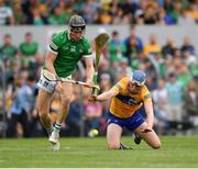 15 May 2022; Conor Boylan of Limerick is tackled by Diarmuid Ryan of Clare during the Munster GAA Hurling Senior Championship Round 4 match between Clare and Limerick at Cusack Park in Ennis, Clare. Photo by John Sheridan/Sportsfile