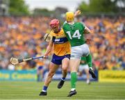 15 May 2022; Séamus Flanagan of Limerick is tackled by John Conlon of Clare during the Munster GAA Hurling Senior Championship Round 4 match between Clare and Limerick at Cusack Park in Ennis, Clare. Photo by John Sheridan/Sportsfile