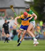 15 May 2022; Paul Flanagan of Clare is tackled by Gearóid Hegarty of Limerick during the Munster GAA Hurling Senior Championship Round 4 match between Clare and Limerick at Cusack Park in Ennis, Clare. Photo by John Sheridan/Sportsfile