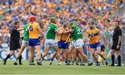 15 May 2022; Clare and Limerick players jostle each other during the Munster GAA Hurling Senior Championship Round 4 match between Clare and Limerick at Cusack Park in Ennis, Clare. Photo by John Sheridan/Sportsfile