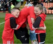 15 May 2022; Derry manager Rory Gallagher celebrates with his children, Seánie, aged 8, Ally, aged 6, and Lucy, aged 10, after the Ulster GAA Football Senior Championship Semi-Final match between Derry and Monaghan at Athletic Grounds in Armagh. Photo by Daire Brennan/Sportsfile