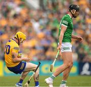 15 May 2022; Aaron Fitzgerald of Clare falls after a clash with Gearóid Hegarty of Limerick during the Munster GAA Hurling Senior Championship Round 4 match between Clare and Limerick at Cusack Park in Ennis, Clare. Photo by Ray McManus/Sportsfile