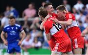 15 May 2022; Derry players, from left, Padraig Cassidy, Gareth McKinless and Paul McNeill celebrate at the final whistle of the Ulster GAA Football Senior Championship Semi-Final match between Derry and Monaghan at Athletic Grounds in Armagh. Photo by Ramsey Cardy/Sportsfile