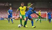 14 May 2022; Nathan Broderick of Rockmount AFC in action against Tayem Dinamumenga of Bluebell United during the FAI Centenary Intermediate Cup Final 2021/2022 match between Rockmount AFC and Bluebell United at Turner's Cross in Cork. Photo by Seb Daly/Sportsfile