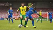 14 May 2022; Nathan Broderick of Rockmount AFC in action against Tayem Dinamumenga of Bluebell United during the FAI Centenary Intermediate Cup Final 2021/2022 match between Rockmount AFC and Bluebell United at Turner's Cross in Cork. Photo by Seb Daly/Sportsfile