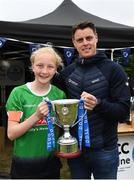 16 May 2022; Peamount United captain is presented the trophy by Clubforce Key Account Executive Ian Morris after the 2022 Clubforce DDSL Girls U13 League Cup Final match, the first time the DDSL has held a schoolgirls' final, between Stepaside FC and Peamount United at the AUL in Dublin. Photo by Harry Murphy/Sportsfile
