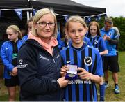 16 May 2022; Player of the match Laura Solomon is presented the award by former Ireland international Olivia O'Toole during the 2022 Clubforce DDSL Girls U13 League Cup Final match, the first time the DDSL has held a schoolgirls' final, between Stepaside FC and Peamount United at the AUL in Dublin. Photo by Harry Murphy/Sportsfile