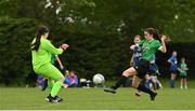 16 May 2022; Sarah Reynolds of Peamount United shoots to score her side's second goal past Stepaside goalkeeper Lilian Tobin during the 2022 Clubforce DDSL Girls U13 League Cup Final match between Stepaside FC and Peamount United at the AUL in Dublin. Photo by Harry Murphy/Sportsfile