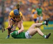 15 May 2022; Diarmaid Byrnes of Limerick is tackled by Shane O'Donnell of Clare during the Munster GAA Hurling Senior Championship Round 4 match between Clare and Limerick at Cusack Park in Ennis, Clare. Photo by Ray McManus/Sportsfile