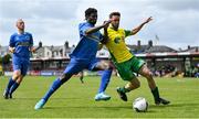 14 May 2022; Baba Issaka of Bluebell United in action against Nathan Broderick of Rockmount AFC during the FAI Centenary Intermediate Cup Final 2021/2022 match between Rockmount AFC and Bluebell United at Turner's Cross in Cork. Photo by Seb Daly/Sportsfile
