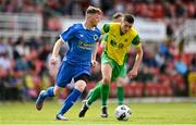 14 May 2022; Conor Walsh of Bluebell United in action against Niall Hanley of Rockmount AFC during the FAI Centenary Intermediate Cup Final 2021/2022 match between Rockmount AFC and Bluebell United at Turner's Cross in Cork. Photo by Seb Daly/Sportsfile