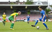 14 May 2022; Colm Karney of Bluebell United in action against Ken Hoey of Rockmount AFC during the FAI Centenary Intermediate Cup Final 2021/2022 match between Rockmount AFC and Bluebell United at Turner's Cross in Cork. Photo by Seb Daly/Sportsfile