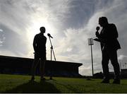 16 May 2022; Laois manager Declan Qualter is interviewed by TG4 presenter Micheál Ó Domhnaill before the Electric Ireland Leinster GAA Minor Hurling Championship Final match between Laois and Offaly at MW Hire O'Moore Park in Portlaoise, Laois. Photo by Harry Murphy/Sportsfile