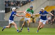 16 May 2022; Shane Rigney of Offaly in action against Andrew McDonagh and Kevin Byrne of Laois during the Electric Ireland Leinster GAA Minor Hurling Championship Final match between Laois and Offaly at MW Hire O'Moore Park in Portlaoise, Laois. Photo by Harry Murphy/Sportsfile