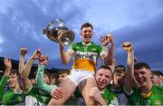 16 May 2022; Offaly captain Dan Ravenhill celebrates with the trophy and teammates after his side's victory in the Electric Ireland Leinster GAA Minor Hurling Championship Final match between Laois and Offaly at MW Hire O'Moore Park in Portlaoise, Laois. Photo by Harry Murphy/Sportsfile