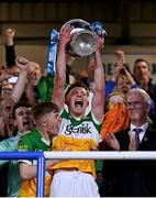 16 May 2022; Offaly captain Dan Ravenhill lifts the trophy after his side's victory in the Electric Ireland Leinster GAA Minor Hurling Championship Final match between Laois and Offaly at MW Hire O'Moore Park in Portlaoise, Laois. Photo by Harry Murphy/Sportsfile