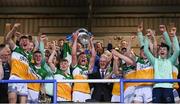 16 May 2022; Offaly captain Dan Ravenhill lifts the trophy after his side's victory in the Electric Ireland Leinster GAA Minor Hurling Championship Final match between Laois and Offaly at MW Hire O'Moore Park in Portlaoise, Laois. Photo by Harry Murphy/Sportsfile