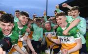 16 May 2022; Offaly players celebrate with Offaly supporter Mick McDonagh after their side's victory in the Electric Ireland Leinster GAA Minor Hurling Championship Final match between Laois and Offaly at MW Hire O'Moore Park in Portlaoise, Laois. Photo by Harry Murphy/Sportsfile