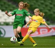 17 May 2022; The SPAR FAI Primary School 5s National Finals took place in AVIVA Stadium on Tuesday, May 17, where former Republic of Ireland International David Meyler and current Republic of Ireland women's footballer, Louise Quinn were in attendance supporting as girls and boys from 28 schools took to the field in a day that they will never forget. The 2022 SPAR FAI Primary School 5s Programme returned in physical form this year and saw an incredible 56,212 students involved from 1,081 schools. Pictured is Tess Graham of Scoil Íosagáin, Donegal, in action against Róisín Humber of Scoil Mhuire, Galway, at the Aviva Stadium in Dublin. Photo by Harry Murphy/Sportsfile