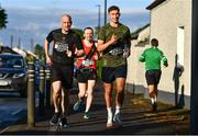 17 May 2022; Emmett Quinn, left, and Conor Masterson of Lucan Harriers AC, Dublin, warm-up before the Kia Race Series – Bob Heffernan & Mary Hanley 5K in Enfield, Meath. Photo by Ben McShane/Sportsfile