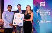 17 May 2022; Matt Steerman, Commercial Director at Pundit Arena, centre, presents Mohammed Mahomed, co-Founder of Her Sport, and Niamh Tallon, co-Foundeer of Her Sport, with the Best Use of Communications Platforms in Sport award during the Irish Sport Industry Awards 2022, in association with Clubforce, at The Westin Hotel in Dublin. Photo by Stephen McCarthy/Sportsfile