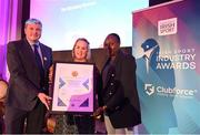 17 May 2022; Niamh Daffy, CEO, Cara Sport Inclusion Ireland, presents Graham Clifford,  Founder and CEO, The Sanctuary Runners, and Chawa Ndlovu with the Best Initiative to Promote Inclusivity in Sport and Physical Activity award during the Irish Sport Industry Awards 2022, in association with Clubforce, at The Westin Hotel in Dublin. Photo by Stephen McCarthy/Sportsfile