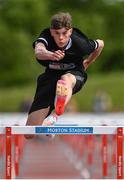 18 May 2022; Sean Owens of Coláiste Éanna, Dublin, on his way to winning the Intermediate Boys 100 metres hurdles during day one of the Irish Life Health Leinster Schools Track and Field Championships at Morton Stadium in Santry, Dublin. Photo by Seb Daly/Sportsfile