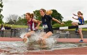 18 May 2022; Della McLoughlin of Coláiste Íosagáin, Portarlington, Offaly, left, and Alison Walsh of Mount Anville Secondary School, Dublin, competing in the Intermediate Girls 1500 metres Steeplechase during day one of the Irish Life Health Leinster Schools Track and Field Championships at Morton Stadium in Santry, Dublin. Photo by Seb Daly/Sportsfile
