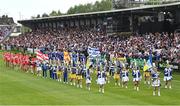 15 May 2022; Both teams parade behind the Mayobridge band before the Ulster GAA Football Senior Championship Semi-Final match between Derry and Monaghan at Athletic Grounds in Armagh. Photo by Ramsey Cardy/Sportsfile