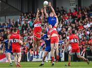 15 May 2022; Niall Kearns of Monaghan and Shane McGuigan of Derry compete for possession during the Ulster GAA Football Senior Championship Semi-Final match between Derry and Monaghan at Athletic Grounds in Armagh. Photo by Ramsey Cardy/Sportsfile