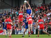 15 May 2022; Niall Kearns of Monaghan and Shane McGuigan of Derry compete for possession during the Ulster GAA Football Senior Championship Semi-Final match between Derry and Monaghan at Athletic Grounds in Armagh. Photo by Ramsey Cardy/Sportsfile