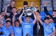 18 May 2022; Dublin's Clyde Burke lifts the cup after the Electric Ireland Leinster GAA Minor Football Championship Final match between Dublin and Kildare at MW Hire O'Moore Park in Portlaoise, Laois. Photo by Stephen McCarthy/Sportsfile